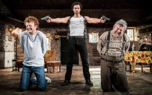 Production photo of Chris Walley, Aidan Turner and Denis Conway in The Lieutenant Of Inishmore by Martin McDonagh, directed by Michael Grandage