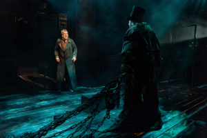 Production shot of Stephen Tompkinson as Scrooge and Michael Rouse as marley in A Christmas Carol at The Old Vic London