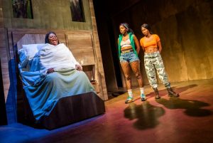 Production photo of Cecilia Noble, Tamara Lawrence and Adelayo Adedayo in Is God Is at the Royal Court theatre in London