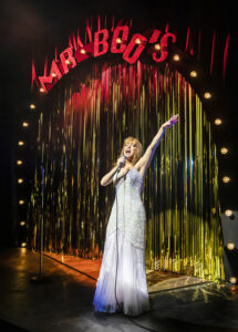 Production photo of Christina Bianco in the 2022 touring production of Jim Cartwright's The Rise and Fall of Little Voice