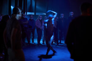 Production photo from Punchdrunk's The Burnt City at One Cartridge Place woolwich London in 2022 showing dancer Alison Monique Adnet