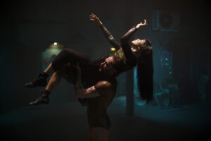 Production photo from Punchdrunk's The Burnt City featuring dancers Yilin Kong and Steven James Apicello