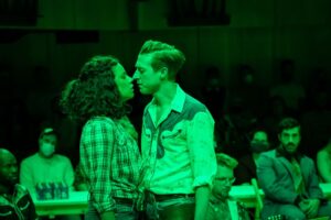 Production photo from Oklahoma! at Young Vic theatre in London showing actora Anoushka Kucas and Arthur Darvill 2022