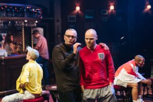 Production photo from Sing Yer Heart Out For The Lads at Chichester's Minerva Theatre 2022 showing Michael Hidgson and Richard Riddell