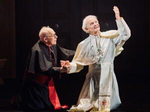 Production photo from The Two Popes at Rose Theatre near London showing Nicholas Woodeson holding Anton Lesser in September 2022