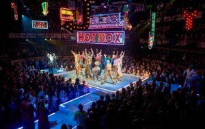The cast of Guys And Dolls at the Bridge Theatre London dance on stage
