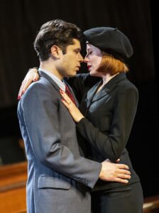 A man and woman embrace in a scene from Witness For The Prosecution at County Hall